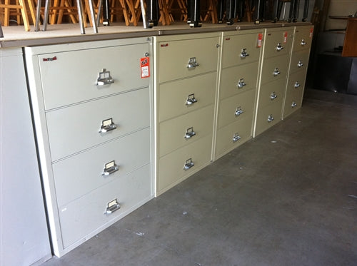 A row of white fireproof file cabinets